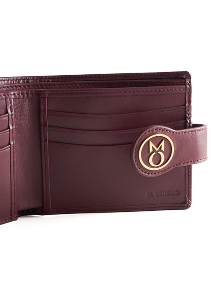 Burgundy leather wallet with 'M. Othello' branding on a light background