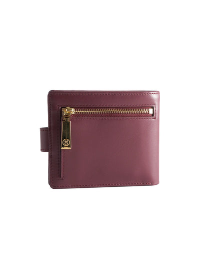 Burgundy leather wallet with 'M. Othello' branding on a light background
