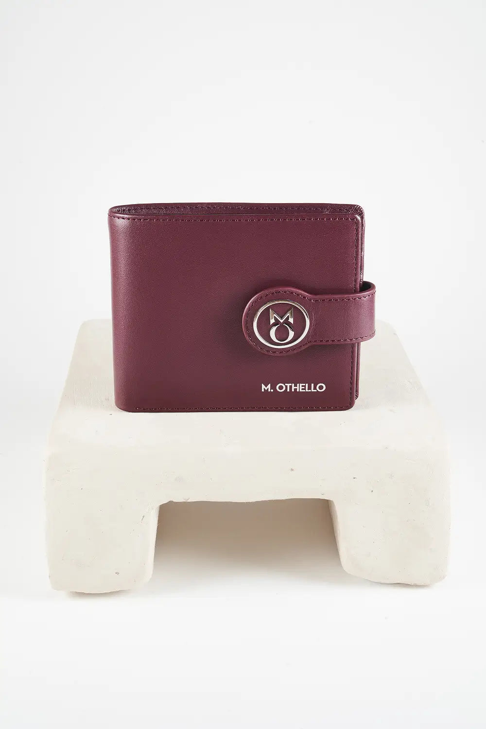 Burgundy bi-fold wallet with brand logo on a light background