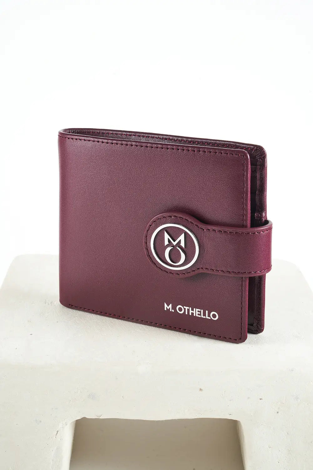 Burgundy bi-fold wallet with brand logo on a light background