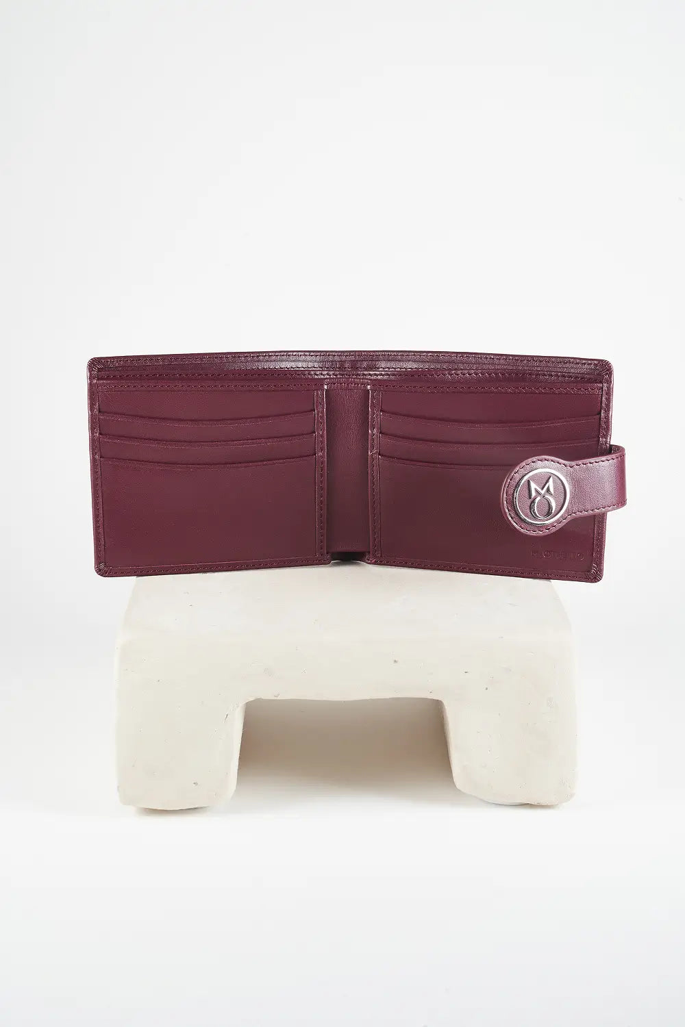 Burgundy bi-fold wallet with brand logo on a light background