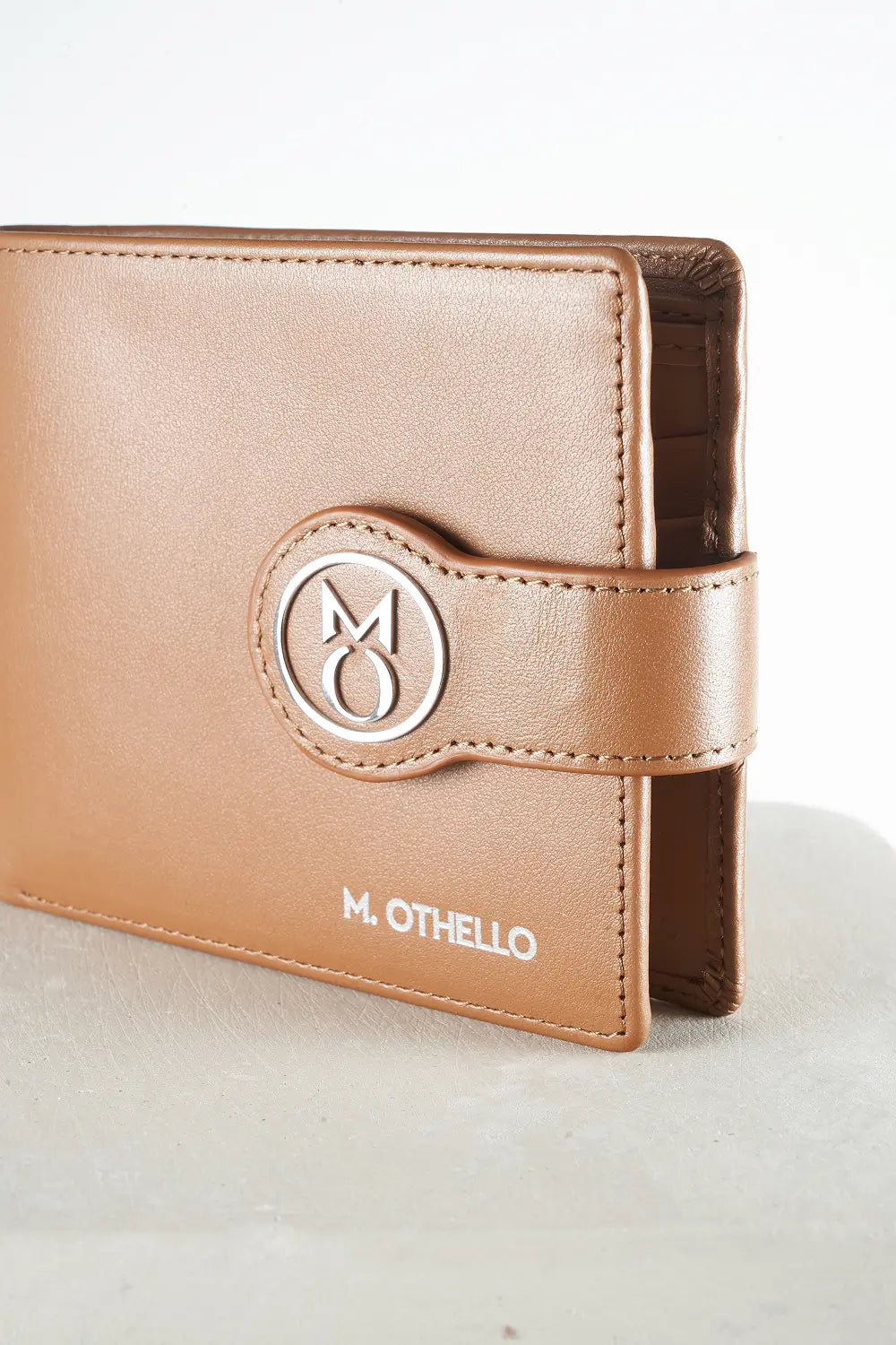 Brown bi-fold wallet with brand logo on a light background