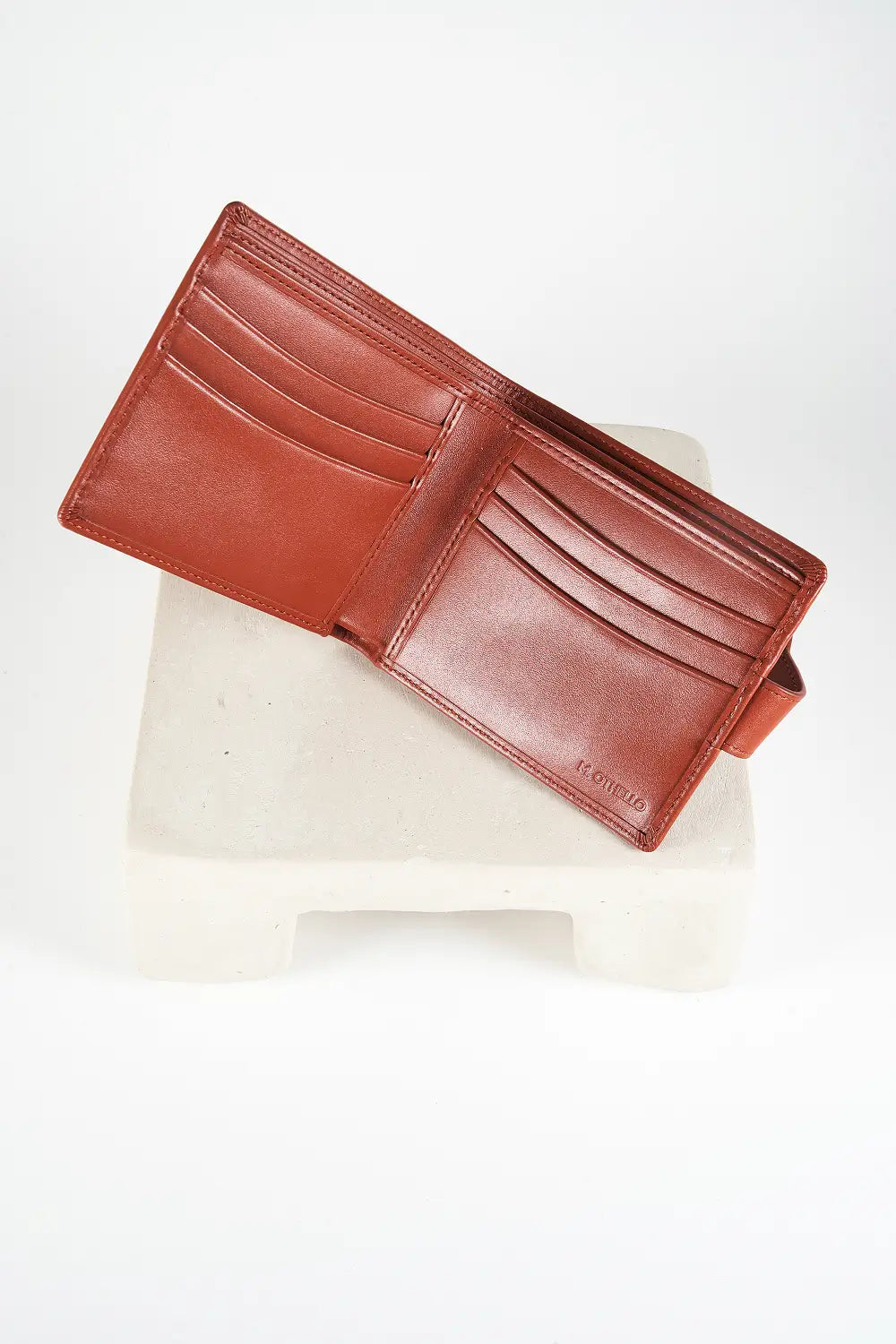 Brown bi-fold wallet with brand logo on a light background