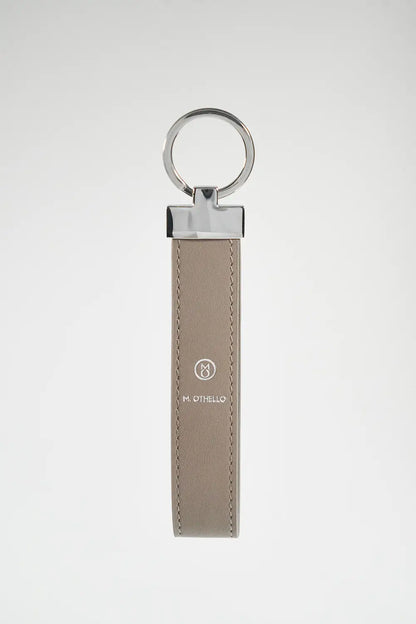 Gray keychain with silver ring on a light gray background