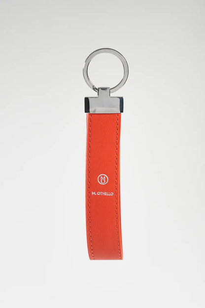 Orange keychain with silver ring on a light gray background