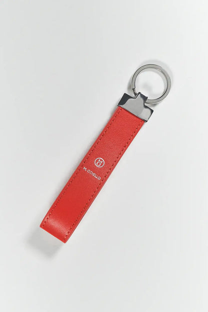 Orange keychain with silver ring on a light gray background