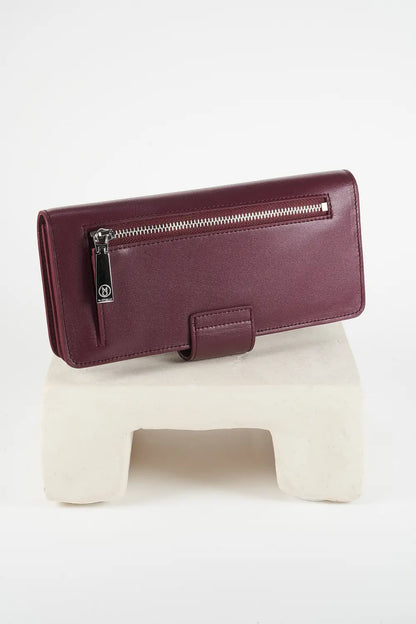 Burgundy leather wallet with 'M. Othello' branding on a light gray background.