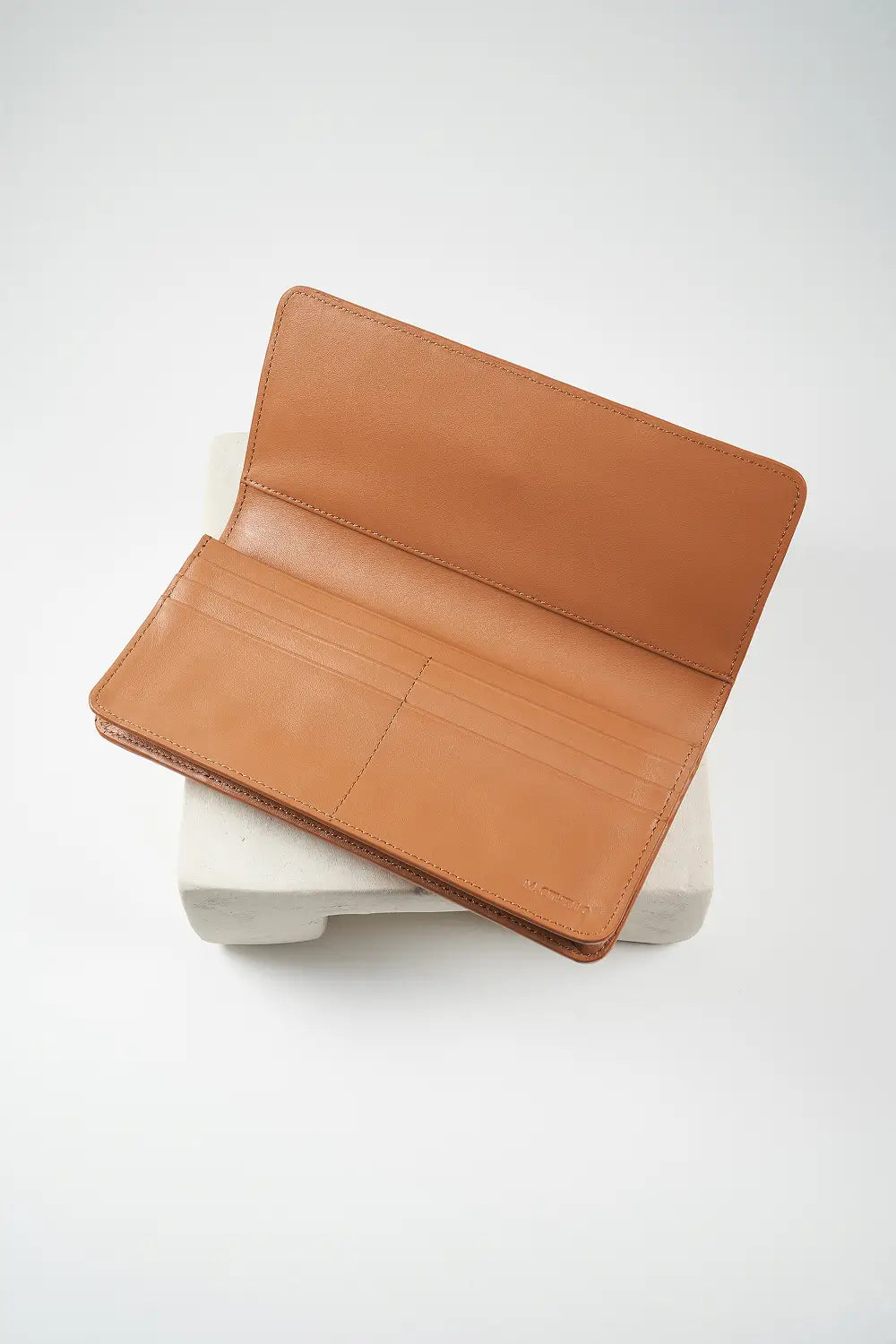 Brown leather wallet on a white background