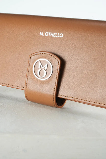 Brown leather product with 'M. Othello' branding on a light gray background