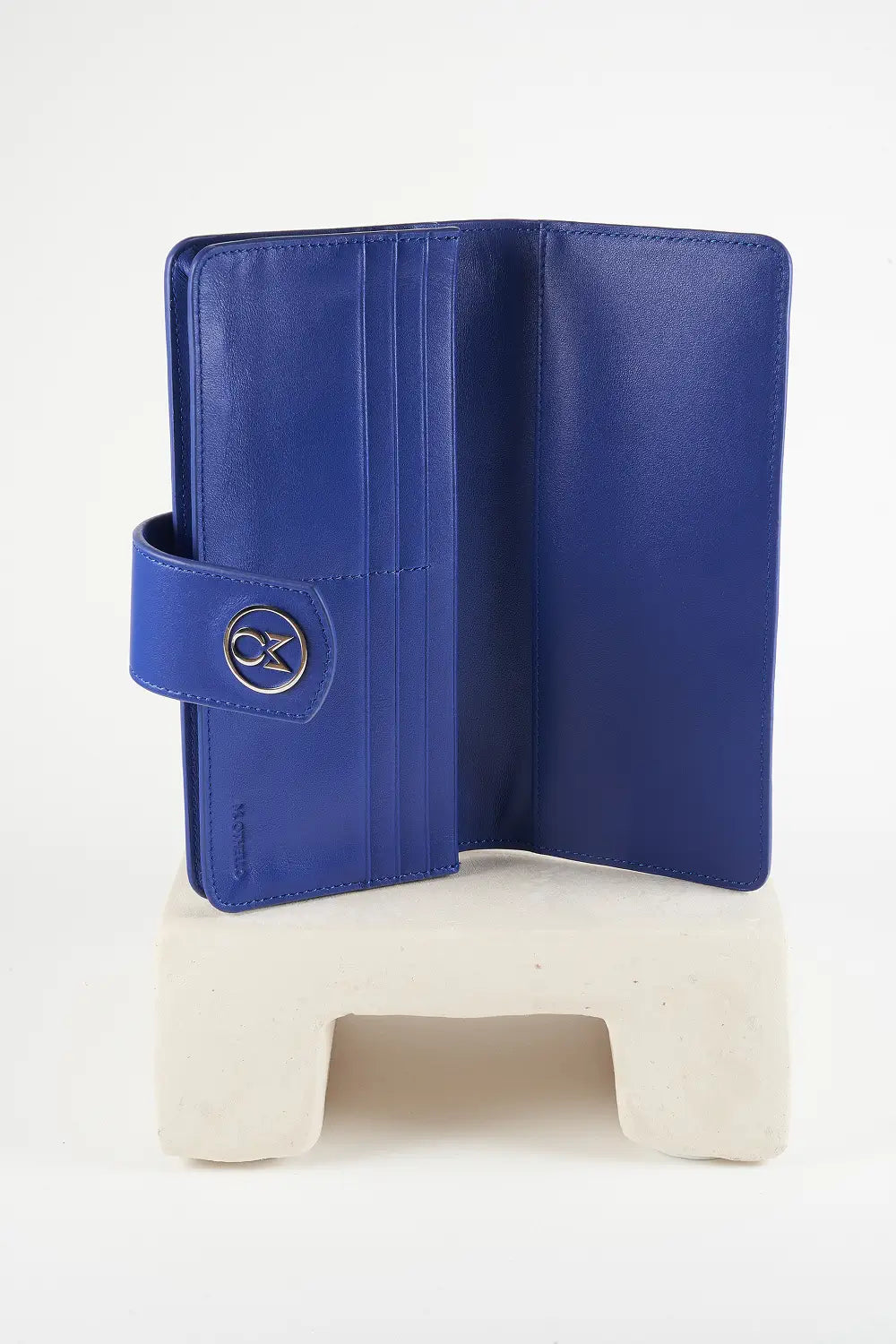 Blue wallet with brand logo on a light background