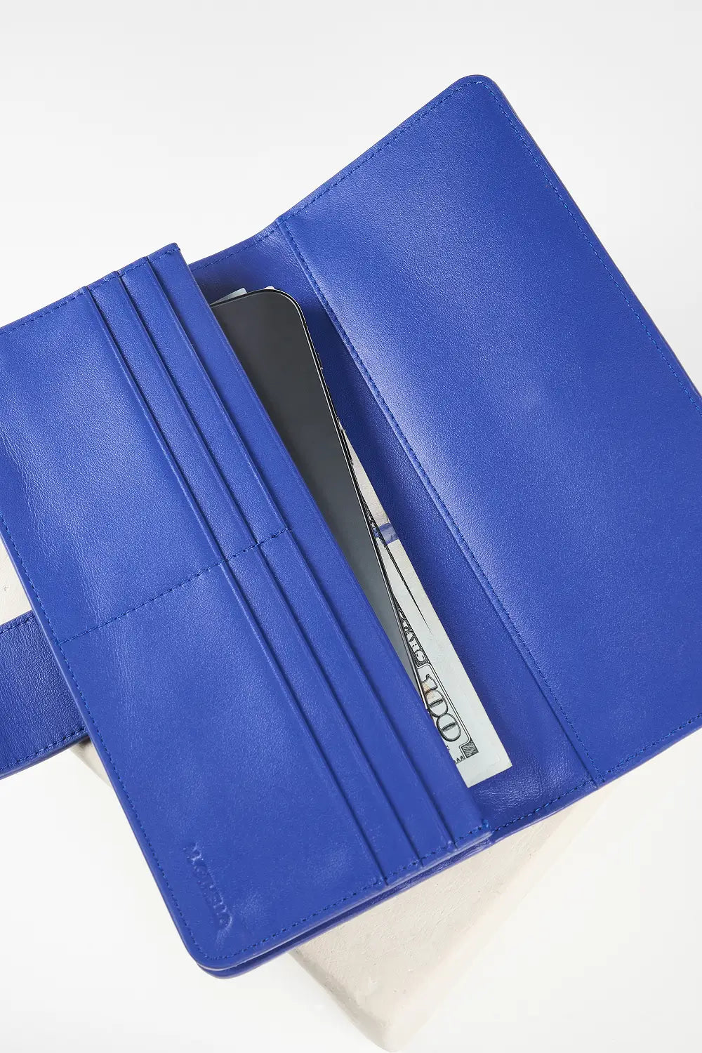 Blue wallet with brand logo on a light background