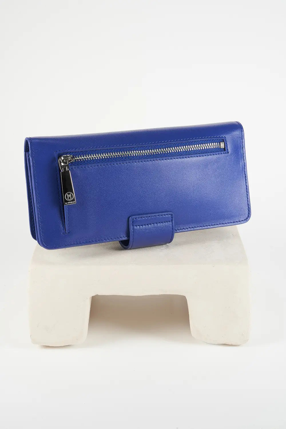 Blue wallet with brand logo on a light background