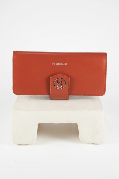 Brown leather wallet on a white surface