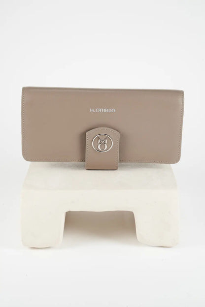 Gray leather phone wallet with 'M. Othello' branding on a light background
