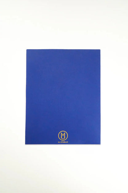 Blue leather mousepad with 'M. Othello' logo on a light background