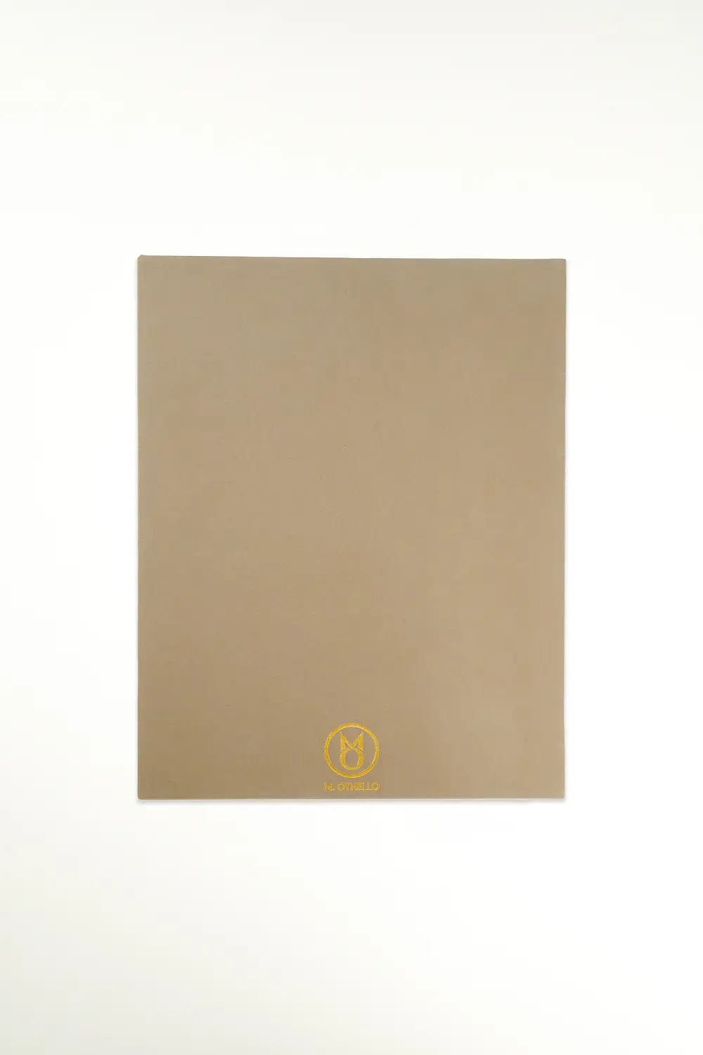 Gray leather mousepad with 'M. Othello' logo on a light background